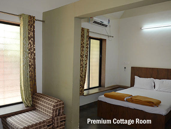 Ladghar Beach : Stay in AC premium cottages at Blue Breeze Resort.